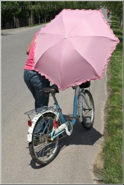 blue bike pink umbrella