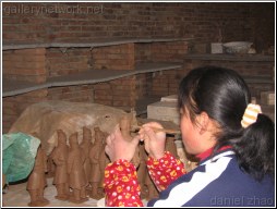 making clay terracotta warriors - Daniel Zhao