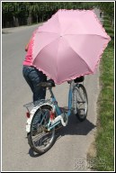 blue bike pink umbrella