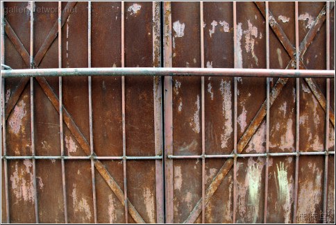 rusted door with bars