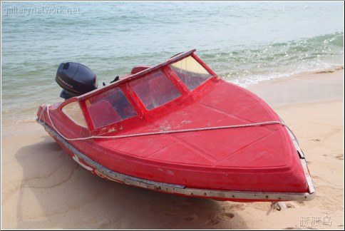 red beached boat