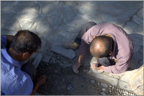 laying stones in the road