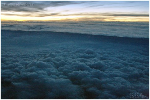 city below cloudscape