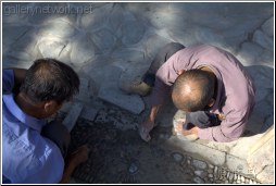 laying stones in the road